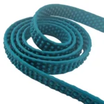 green textured PVC dog leash with copper hook and textured strap, on a white background.