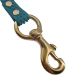 green textured PVC dog leash with copper hook and textured strap, on a white background.