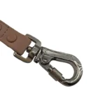 teal PVC dog leash with textured strap, metal swivel clasp, and reinforced end, on a white background.