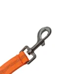 orange tactical dog leash with tactical strap, reinforced handle, and metal snap hook, on a white background.