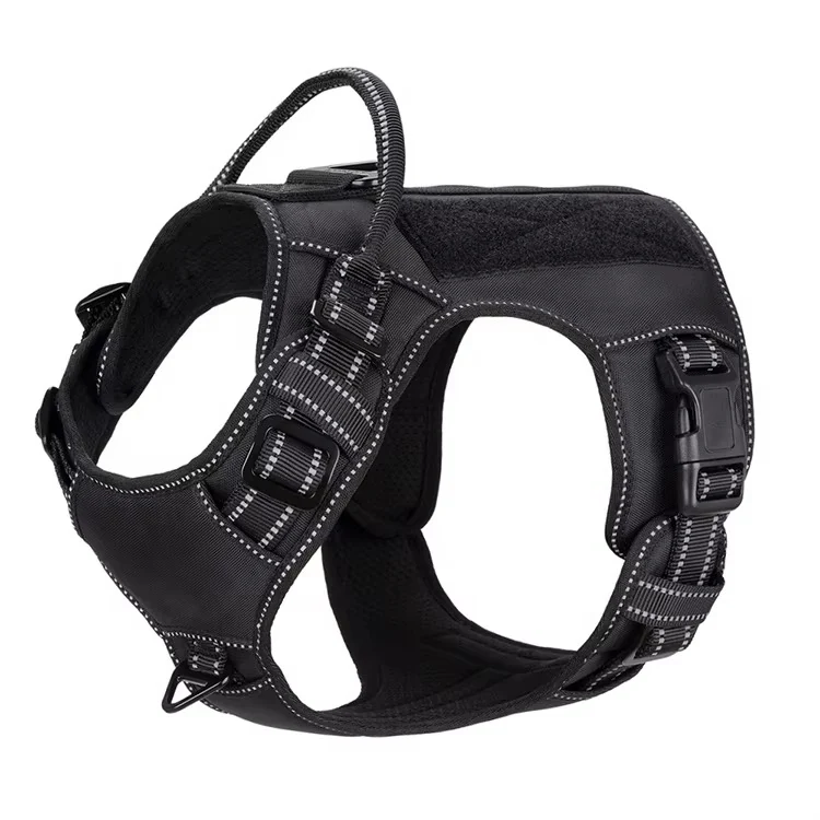 black tactical dog harness with adjustable straps, padded chest panel, and metal D-rings, on a white background.
