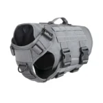light gray tactical Molle dog harness with black webbing, adjustable straps, and metal D-rings, on a white background.